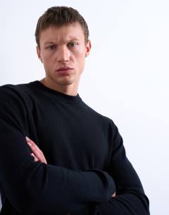 Model wearing Essential knitted crew neck in black