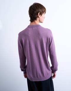 Model wearing Essential knitted crew neck in purple