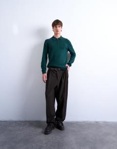 Model wearing Essential knitted zip polo in dark green