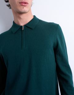 Model wearing Essential knitted zip polo in dark green