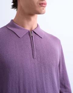 Model wearing Essential knitted zip polo in purple