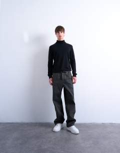 Model wearing Essential roll neck with wool in black