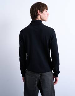 Model wearing Essential roll neck with wool in black