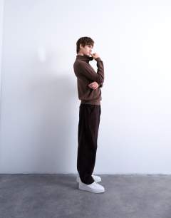 Model wearing Essential roll neck with wool in brown