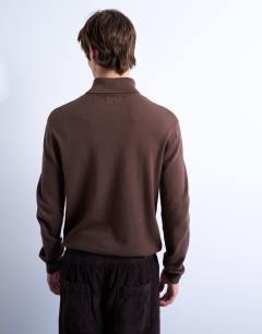 Model wearing Essential roll neck with wool in brown