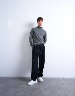 Model wearing Essential roll neck with wool in charcoal