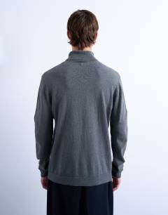 Model wearing Essential roll neck with wool in charcoal