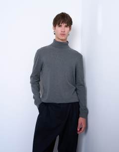 Model wearing Essential roll neck with wool in charcoal