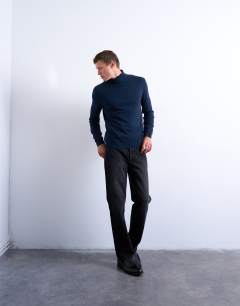 Model wearing Essential roll neck with wool in navy