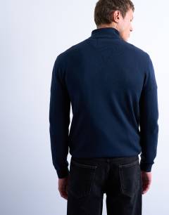 Model wearing Essential roll neck with wool in navy