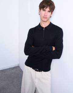 Model wearing Essential zip polo with wool in black