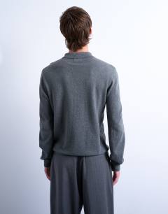 Model wearing Essential zip polo with wool in charcoal