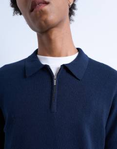 Model wearing Essential zip polo with wool in navy