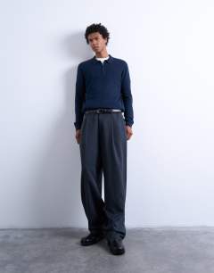 Model wearing Essential zip polo with wool in navy