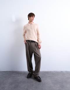 Model wearing Essential zip polo with wool in stone
