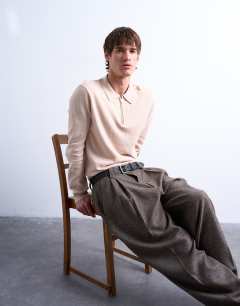 Model wearing Essential zip polo with wool in stone