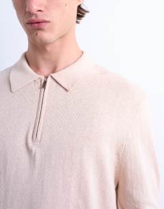 Model wearing Essential zip polo with wool in stone