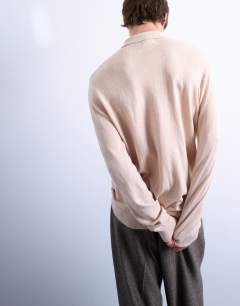 Model wearing Essential zip polo with wool in stone