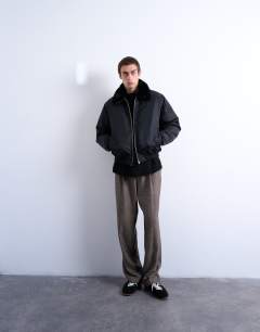 Model wearing Faux fur collar bomber jacket in black