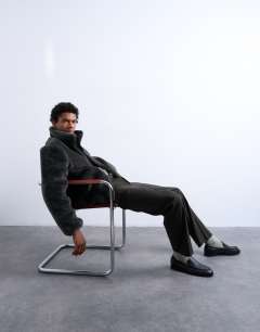 Model wearing Faux fur funnel neck jacket in dark grey