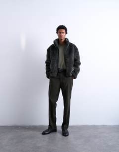 Model wearing Faux fur funnel neck jacket in dark grey