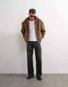 Model wearing Faux fur leapord print bomber jacket in brown