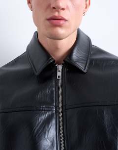 Model wearing Faux leather harrington jacket in black
