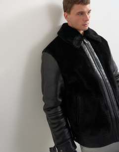 Model wearing Faux shearling jacket in black