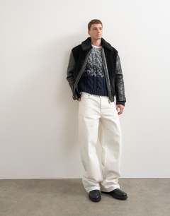 Model wearing Faux shearling jacket in black