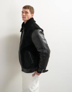 Model wearing Faux shearling jacket in black