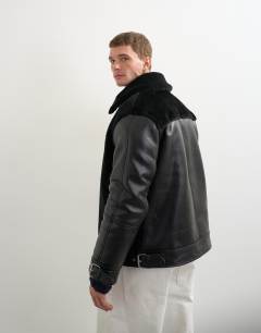 Model wearing Faux shearling jacket in black