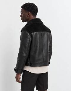Model wearing Faux shearling jacket in black