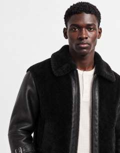 Model wearing Faux shearling jacket in black