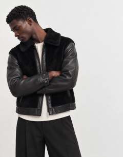 Model wearing Faux shearling jacket in black