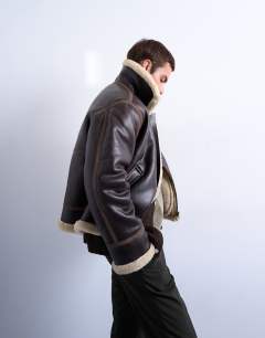 Model wearing Faux shearling jacket in brown