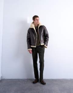 Model wearing Faux shearling jacket in brown