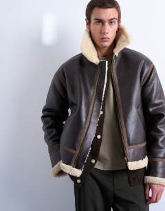 Model wearing Faux shearling jacket in brown