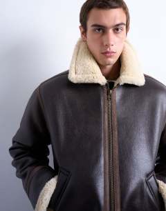 Model wearing Faux shearling jacket in brown