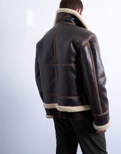 Model wearing Faux shearling jacket in brown