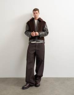 Model wearing Faux shearling jacket in chocolate brown