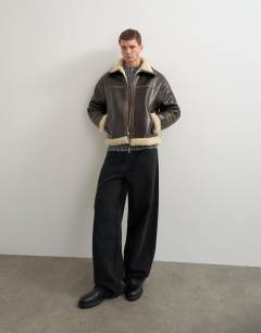 Model wearing Faux shearling jacket in espresso brown