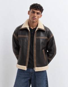 Model wearing Faux shearling jacket in espresso brown
