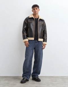 Model wearing Faux shearling jacket in espresso brown