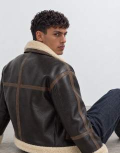 Model wearing Faux shearling jacket in espresso brown