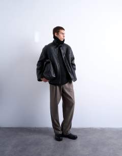 Model wearing Faux shearling jacket with patch pockets in black