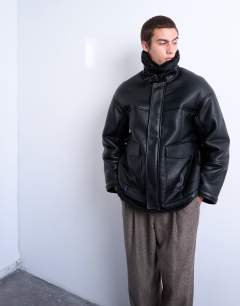 Model wearing Faux shearling jacket with patch pockets in black