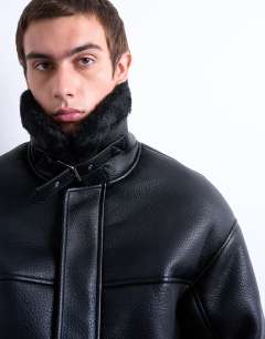 Model wearing Faux shearling jacket with patch pockets in black