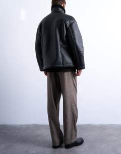 Model wearing Faux shearling jacket with patch pockets in black