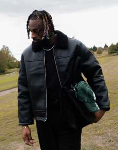 Faux shearling jacket with zip pockets in black