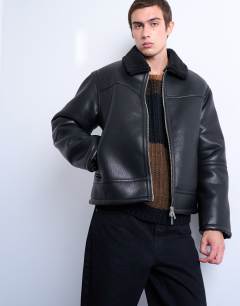 Model wearing Faux shearling jacket with zip pockets in black